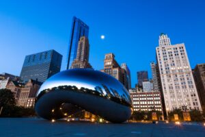 Chicago skyline with the Cloud Gate sculpture in foreground.