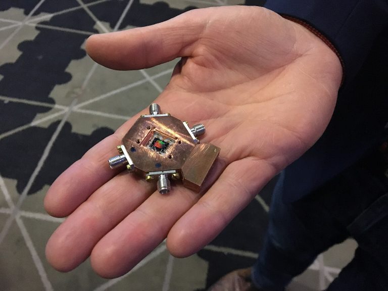 A small quantum computing processor held in a hand