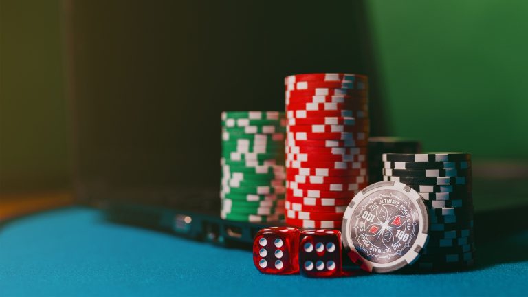 Dice and stacked casino chips on a gaming table